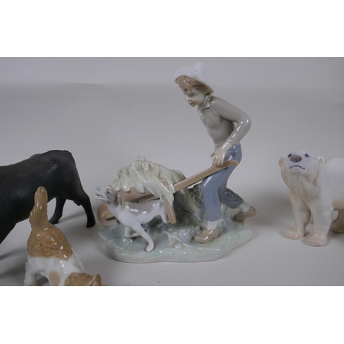 131 - A collection of ceramic animal figures to include Lladro and Nao kittens, a Bing & Grondhal pola... 