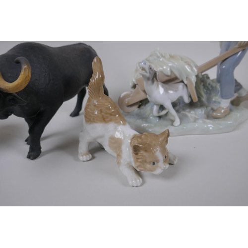 131 - A collection of ceramic animal figures to include Lladro and Nao kittens, a Bing & Grondhal pola... 