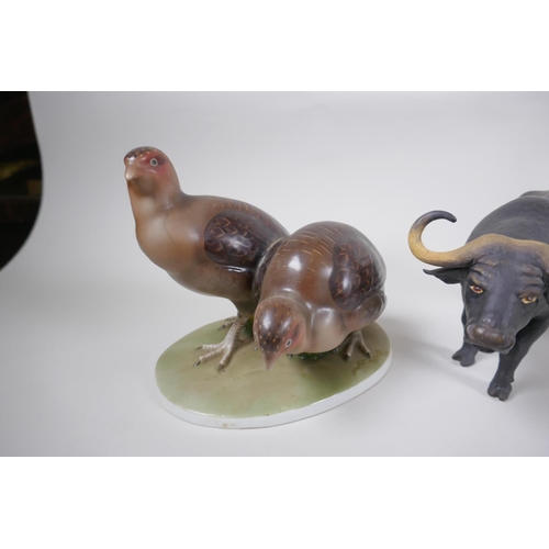 131 - A collection of ceramic animal figures to include Lladro and Nao kittens, a Bing & Grondhal pola... 