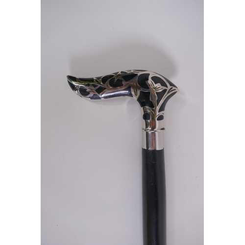 134 - An ebonised wood walking stick with a chromed metal and enamel Art Nouveau style handle, 92cm long