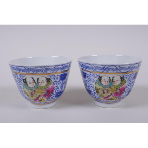 139 - A pair of Chinese blue and white porcelain tea bowls with polychrome enamels panels depicting two fi... 