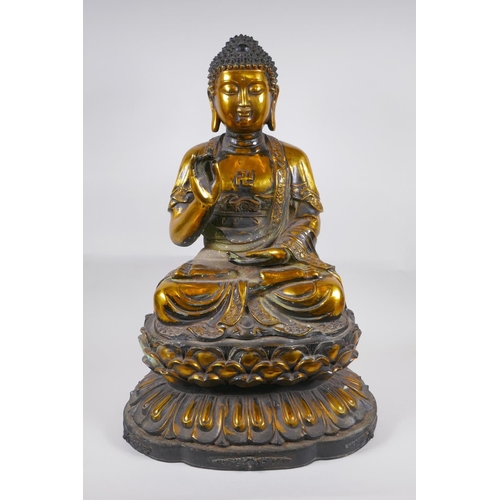 14 - A large Chinese gilt bronze figure of Buddha seated on a lotus throne, 6 character mark to back, 59c... 