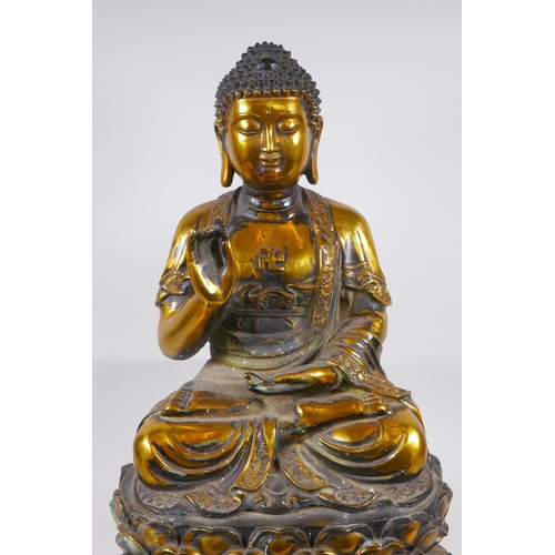 14 - A large Chinese gilt bronze figure of Buddha seated on a lotus throne, 6 character mark to back, 59c... 