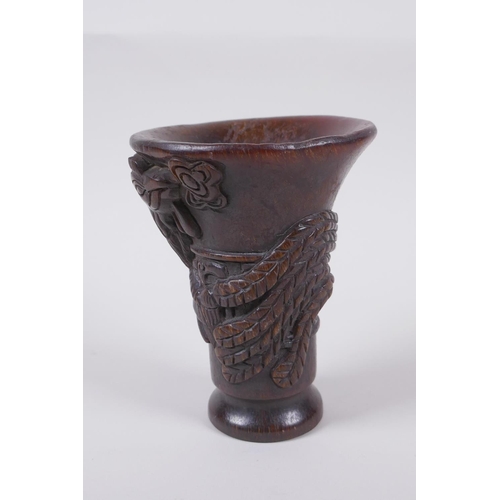 141 - A Chinese faux horn libation cup with phoenix decoration, seal mark to base, 13.5cm high