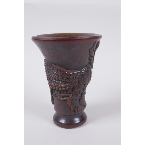 141 - A Chinese faux horn libation cup with phoenix decoration, seal mark to base, 13.5cm high