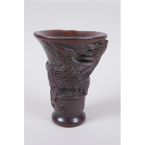 141 - A Chinese faux horn libation cup with phoenix decoration, seal mark to base, 13.5cm high