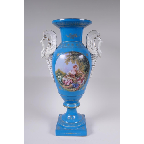 142 - A blue ground Sevres style porcelain urn with two swan shaped handles and decorative panels depictin... 