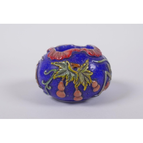 143 - A Chinese blue Peking glass bird feeder with raised and enamelled insect and gourd decoration, mark ... 