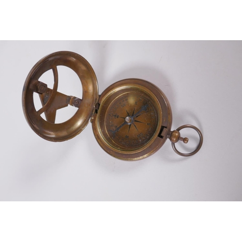 146 - A reproduction brass fob watch sundial compass, and a four draw brass telescope, 39cm long extended