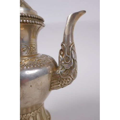 147 - A Tibetan white metal ewer, double vajra mark to base, 20cm high