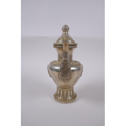 147 - A Tibetan white metal ewer, double vajra mark to base, 20cm high