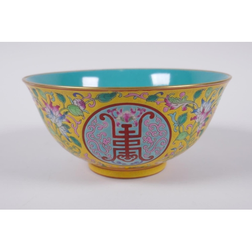 149 - A Chinese polychrome porcelain bowl decorated with auspicious symbols and flowers, character inscrip... 