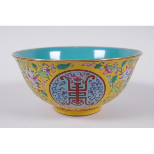 149 - A Chinese polychrome porcelain bowl decorated with auspicious symbols and flowers, character inscrip... 