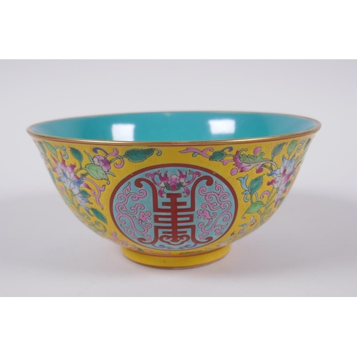 149 - A Chinese polychrome porcelain bowl decorated with auspicious symbols and flowers, character inscrip... 