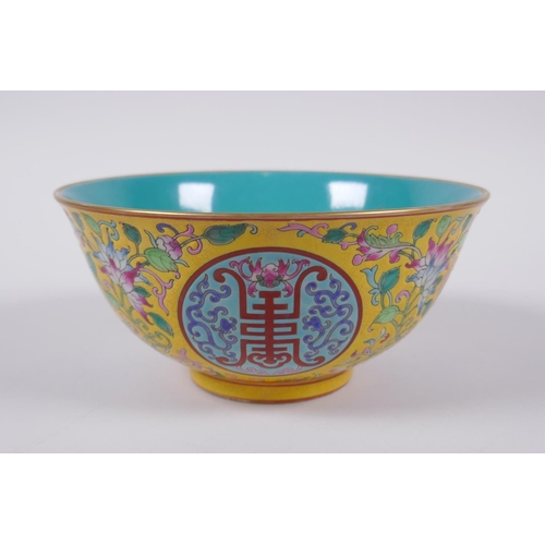 149 - A Chinese polychrome porcelain bowl decorated with auspicious symbols and flowers, character inscrip... 