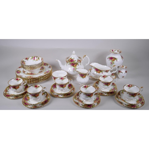 15 - A Royal Albert Old Country Rose six place setting part dinner and tea service, comprising teapot, su... 