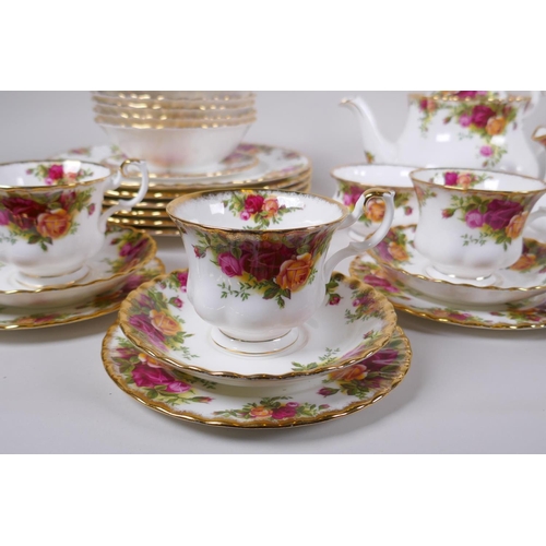 15 - A Royal Albert Old Country Rose six place setting part dinner and tea service, comprising teapot, su... 