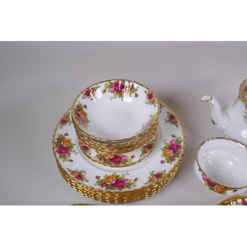 15 - A Royal Albert Old Country Rose six place setting part dinner and tea service, comprising teapot, su... 