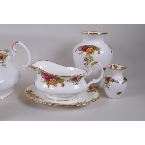 15 - A Royal Albert Old Country Rose six place setting part dinner and tea service, comprising teapot, su... 