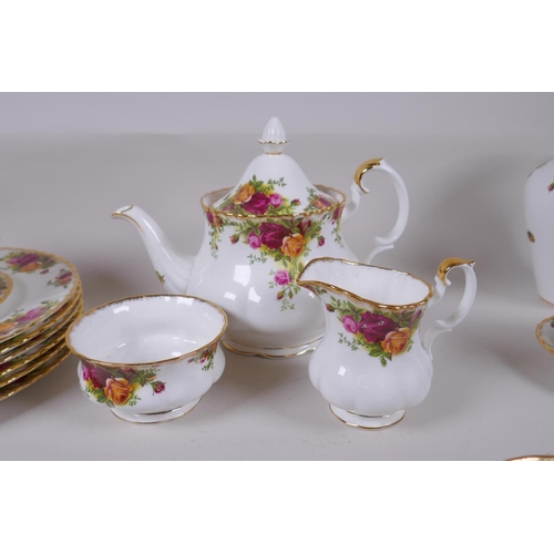 15 - A Royal Albert Old Country Rose six place setting part dinner and tea service, comprising teapot, su... 