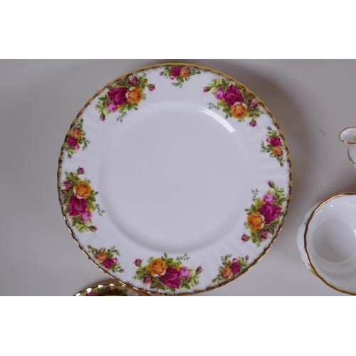 15 - A Royal Albert Old Country Rose six place setting part dinner and tea service, comprising teapot, su... 