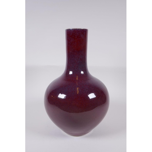 150 - A Chinese flambe glazed porcelain bottle vase, Yong Zheng 6 character mark to base, 33cm high