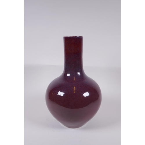 150 - A Chinese flambe glazed porcelain bottle vase, Yong Zheng 6 character mark to base, 33cm high