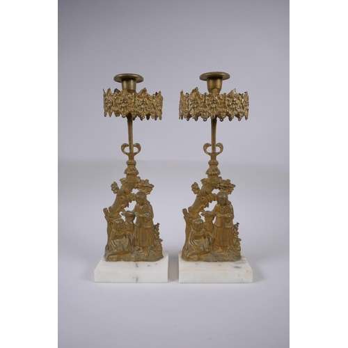 156 - A pair of antique ormolu and marble candlesticks decorated with two girls and a deer, 36cm high