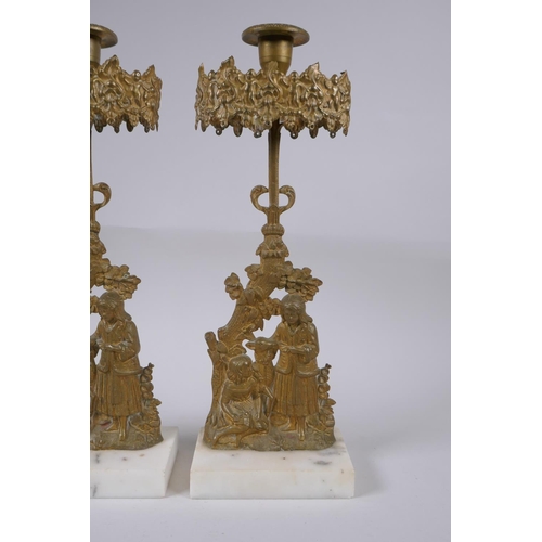 156 - A pair of antique ormolu and marble candlesticks decorated with two girls and a deer, 36cm high