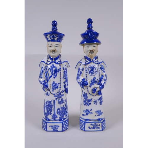 157 - A pair of Chinese Qing Dynasty blue and white porcelain figures, impressed marks to base, 29cm high