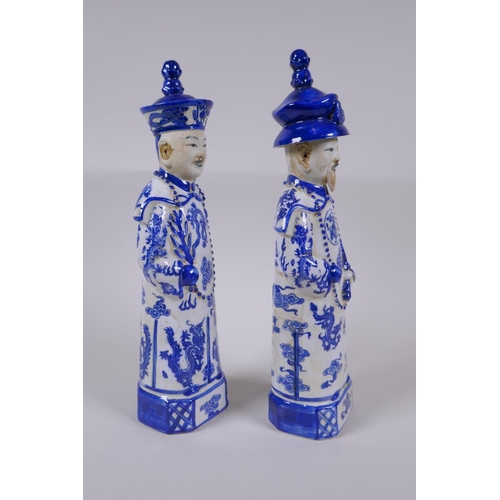 157 - A pair of Chinese Qing Dynasty blue and white porcelain figures, impressed marks to base, 29cm high