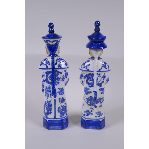 157 - A pair of Chinese Qing Dynasty blue and white porcelain figures, impressed marks to base, 29cm high