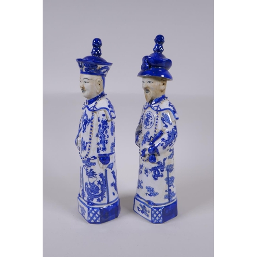 157 - A pair of Chinese Qing Dynasty blue and white porcelain figures, impressed marks to base, 29cm high