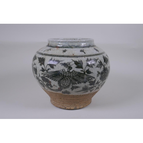 160 - A Chinese blue and white crackleware pottery vase with phoenix and lotus flower decoration, characte... 