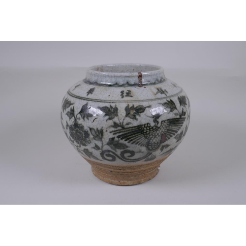 160 - A Chinese blue and white crackleware pottery vase with phoenix and lotus flower decoration, characte... 