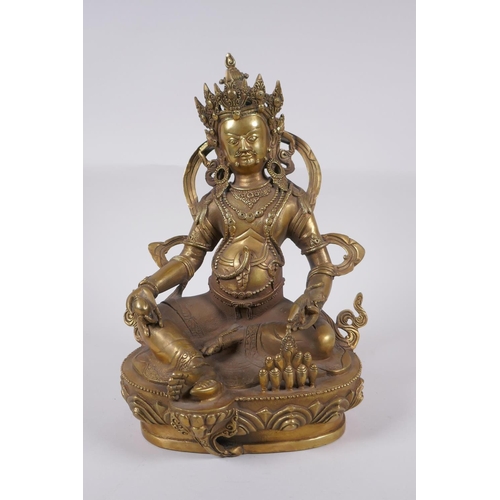 165 - A Tibetan bronze figure of a wrathful deity, impressed double vajra mark to base, 29cm high