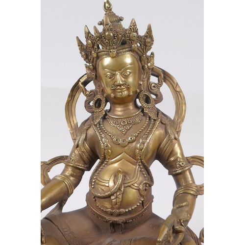 165 - A Tibetan bronze figure of a wrathful deity, impressed double vajra mark to base, 29cm high