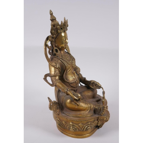 165 - A Tibetan bronze figure of a wrathful deity, impressed double vajra mark to base, 29cm high