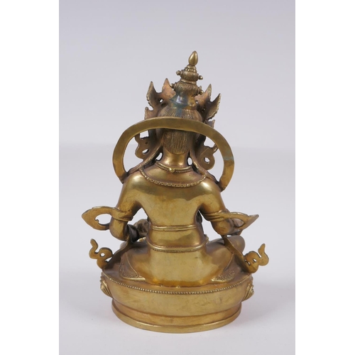 165 - A Tibetan bronze figure of a wrathful deity, impressed double vajra mark to base, 29cm high