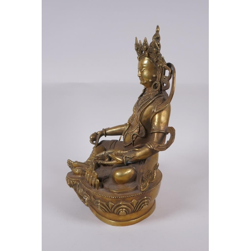 165 - A Tibetan bronze figure of a wrathful deity, impressed double vajra mark to base, 29cm high