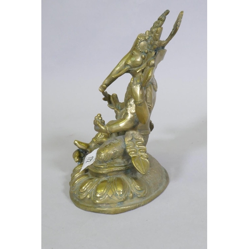 172 - Indian brass figure of Ganesh with a rat under foot, 20cm high