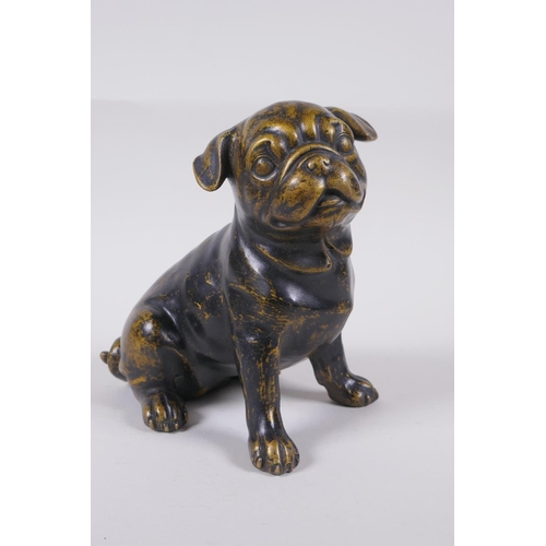 173 - A filled bronze figure of a pug dog, 17cm high