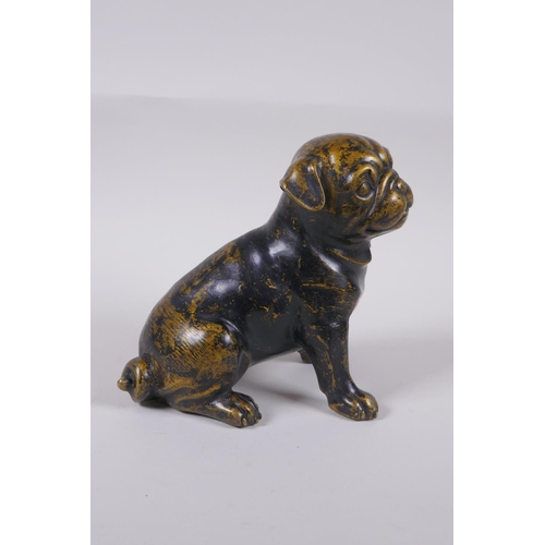 173 - A filled bronze figure of a pug dog, 17cm high