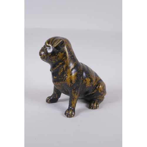 173 - A filled bronze figure of a pug dog, 17cm high