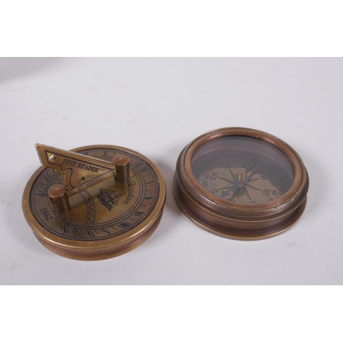 176 - A reproduction brass sundial compass and a brass and leatherette miniature telescope, 13cm long