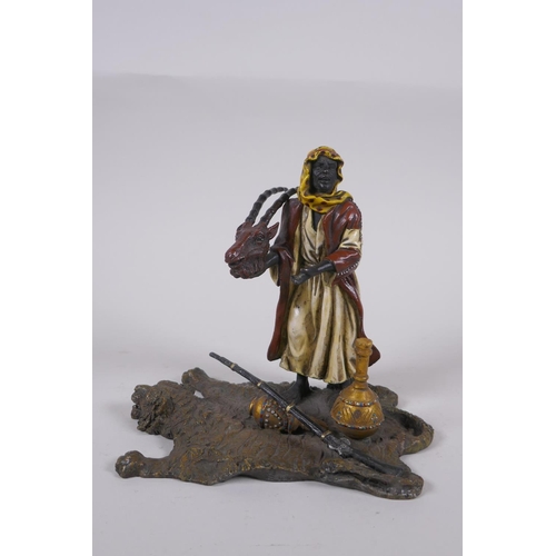 177 - A cold painted bronze figure of an Arab merchant, 14cm high