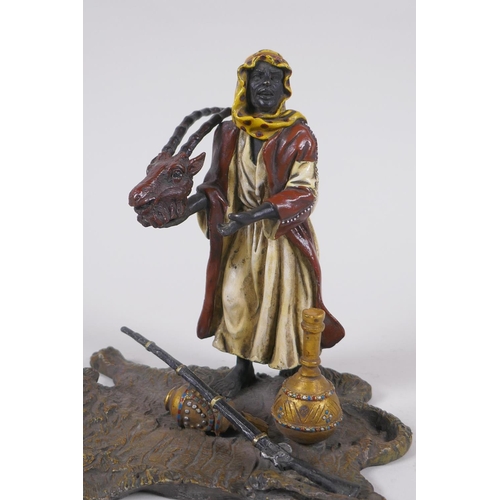 177 - A cold painted bronze figure of an Arab merchant, 14cm high