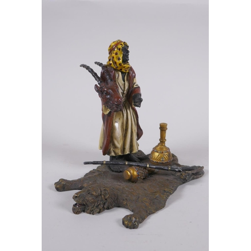 177 - A cold painted bronze figure of an Arab merchant, 14cm high