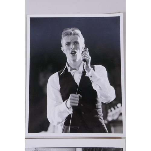 18 - A collection of four black and white press photographs of David Bowie, circa 1976, all with London F... 