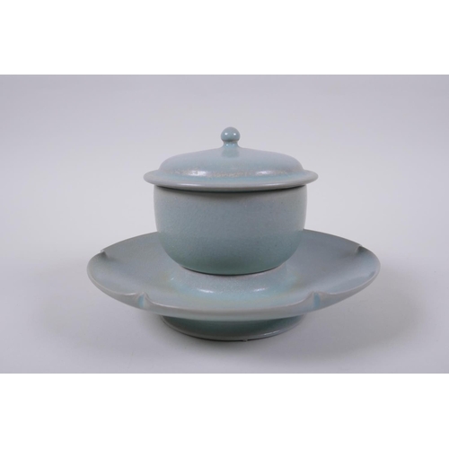 19 - A Chinese Ru ware style tea set comprising a tea bowl, cover and petal shaped saucer, 18cm diameter